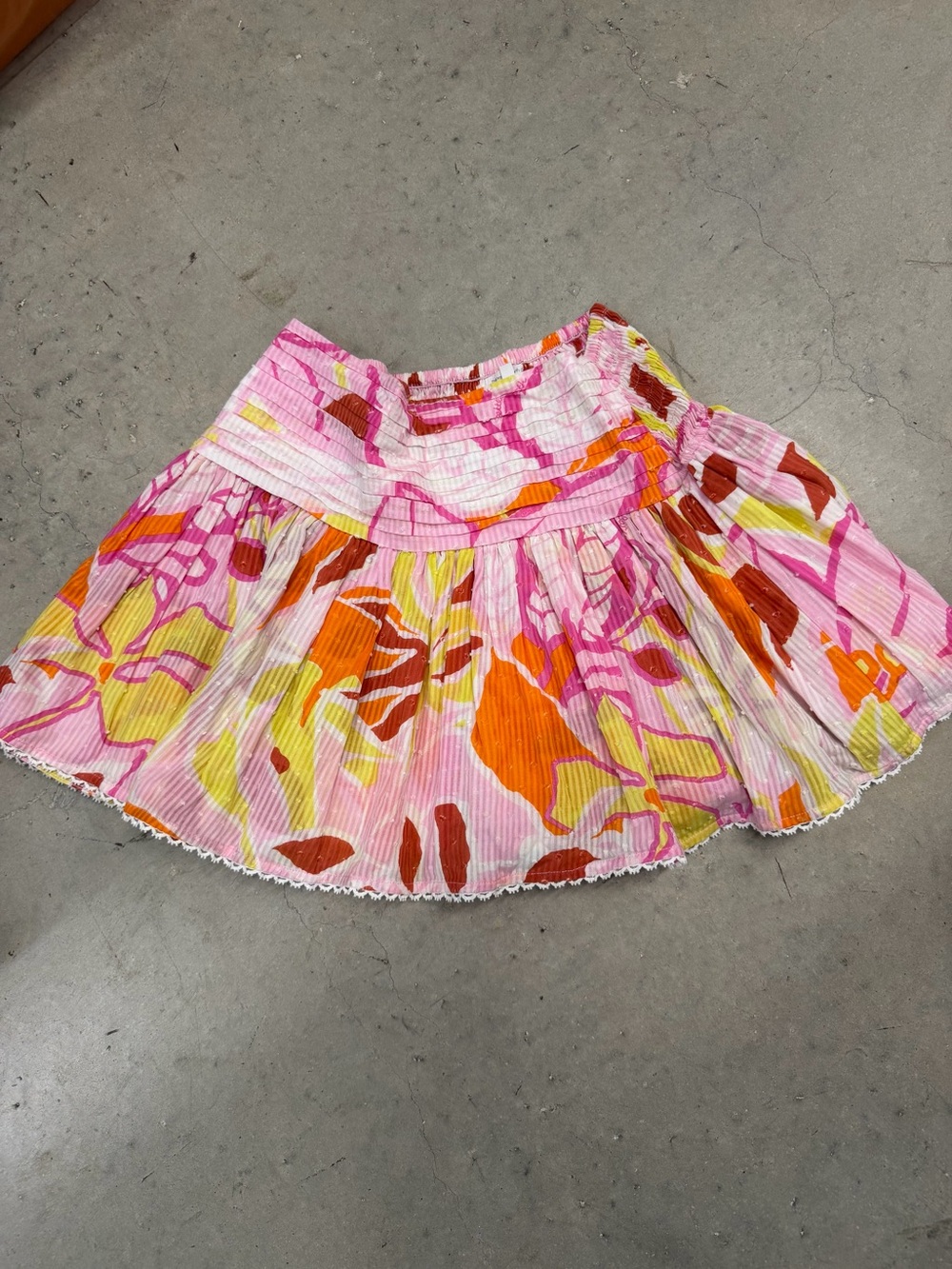 Poupette St. Barth Pink Floral Pleated Mini Skirt with Orange and Yellow Accents